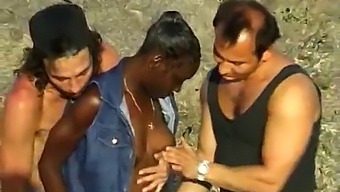 A Black Woman Was Fucked By Two White Men In The Seaside.